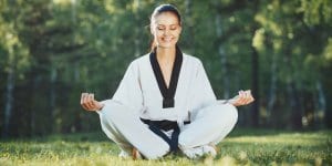 Martial Arts Lessons for Adults in Dolton IL - Happy Woman Meditated Sitting Background